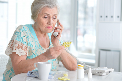 elderly woman calling for her prescription